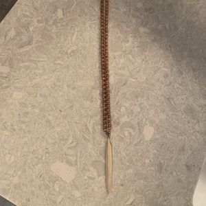 Like new beaded necklace with plastic feather